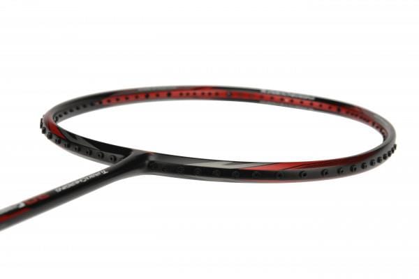 A close-up image of the Li-Ning Turbo Charging 20 Combat badminton racket highlights its sleek, aerodynamic design in a striking black and red color scheme. The focus is on the Ultra Carbon head and strings against a plain white background, underscoring its premium quality.