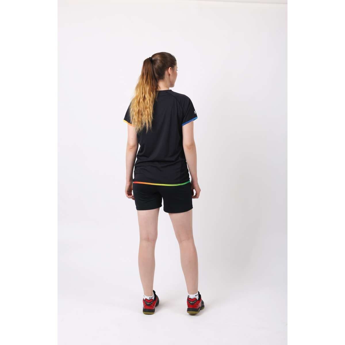 A woman in a black FZ Forza Bulgur Solibad Badminton T-shirt and shorts.