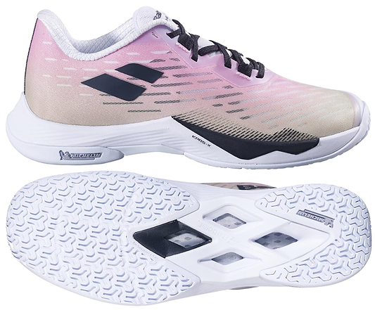 The Babolat Shadow Tour 5 Womens Badminton Shoes in pink and green feature a textured white sole with black geometric cutouts for superior indoor court grip, shown from the side and bottom, with black laces and the Babolat logo.