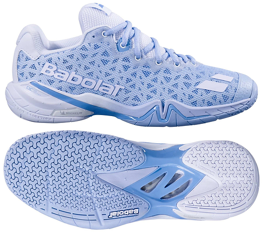 The Babolat Shadow 4 Womens Badminton Shoes in Snow Blue feature a mesh upper, textured sole, white laces, and Babolat branding, shown from side and bottom views.