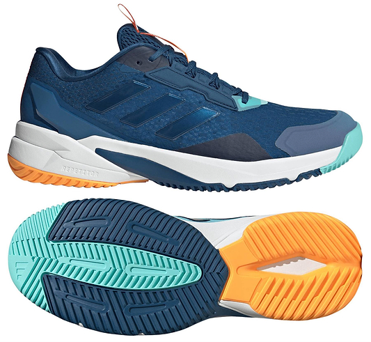 A navy adidas Crazyflight 6 men's indoor badminton shoe is shown from the side, highlighting teal and orange accents, a white midsole, and textured sole. The other shoe displays its colorful patterned outsole.