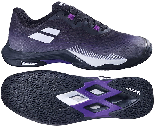The Babolat Shadow Tour 5 Womens Badminton Shoes in black and purple are shown, highlighting a side view and a Michelin-branded textured sole. Ideal as badminton court shoes.