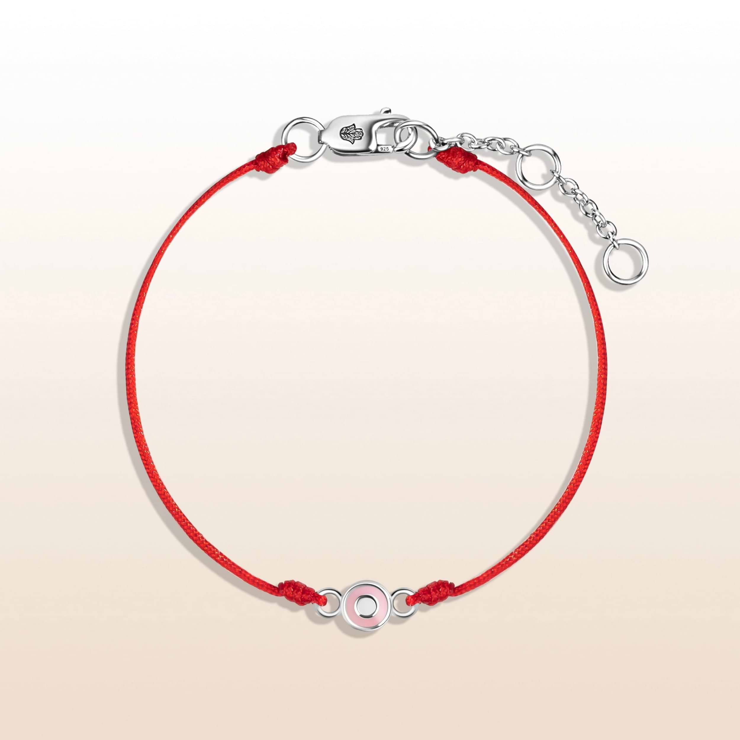  "Protected by Love - Baby Girl Silver Evil Eye Red Bracelet" has the perfect frequencies for your little girl's heart to flourish and grow. A symbol of care and protection, this enchanting Evil Eye charm is sure to add joyful energy to her everyday activities.