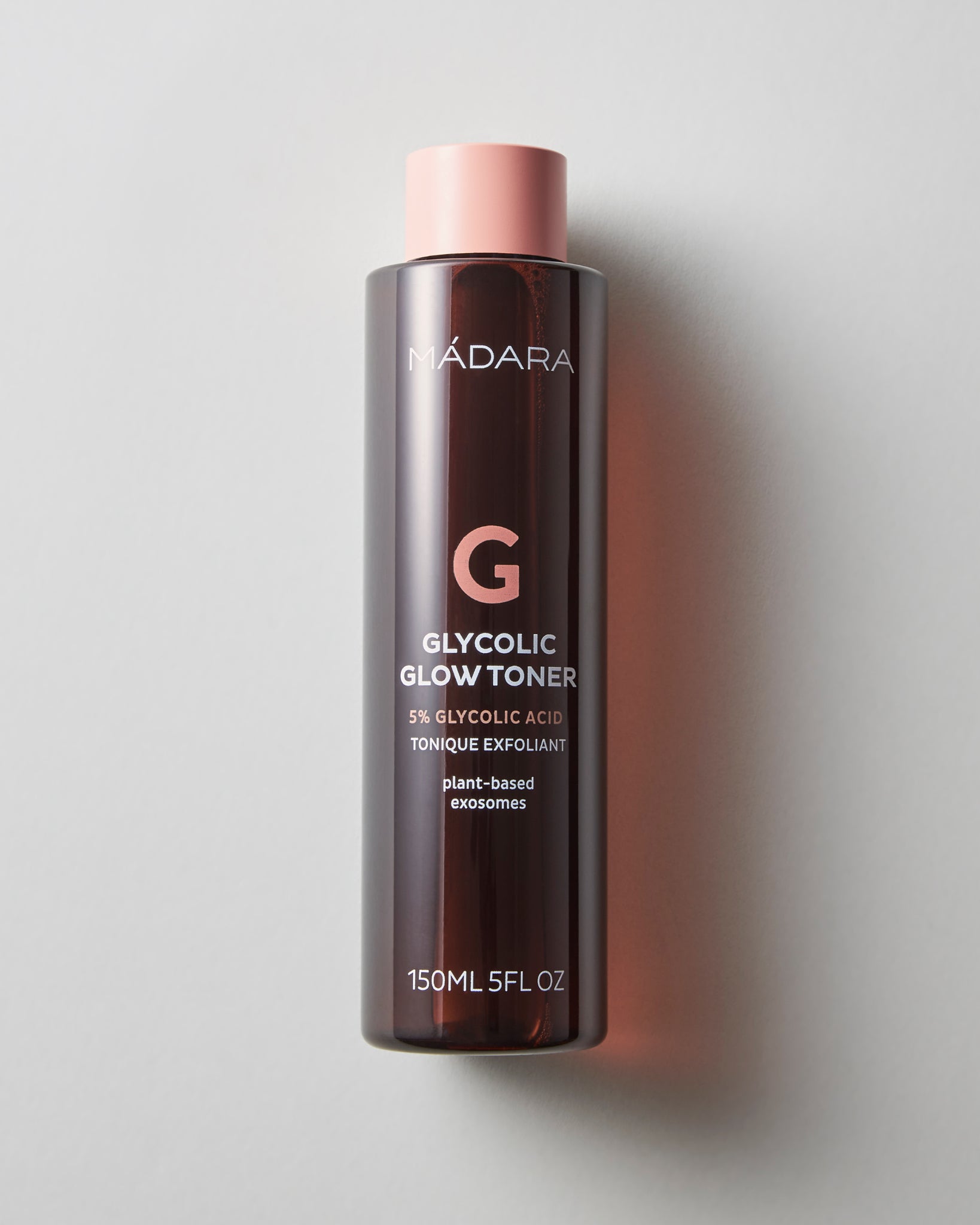 MADARA Glycolic Glow Toner bottle on a light gray background