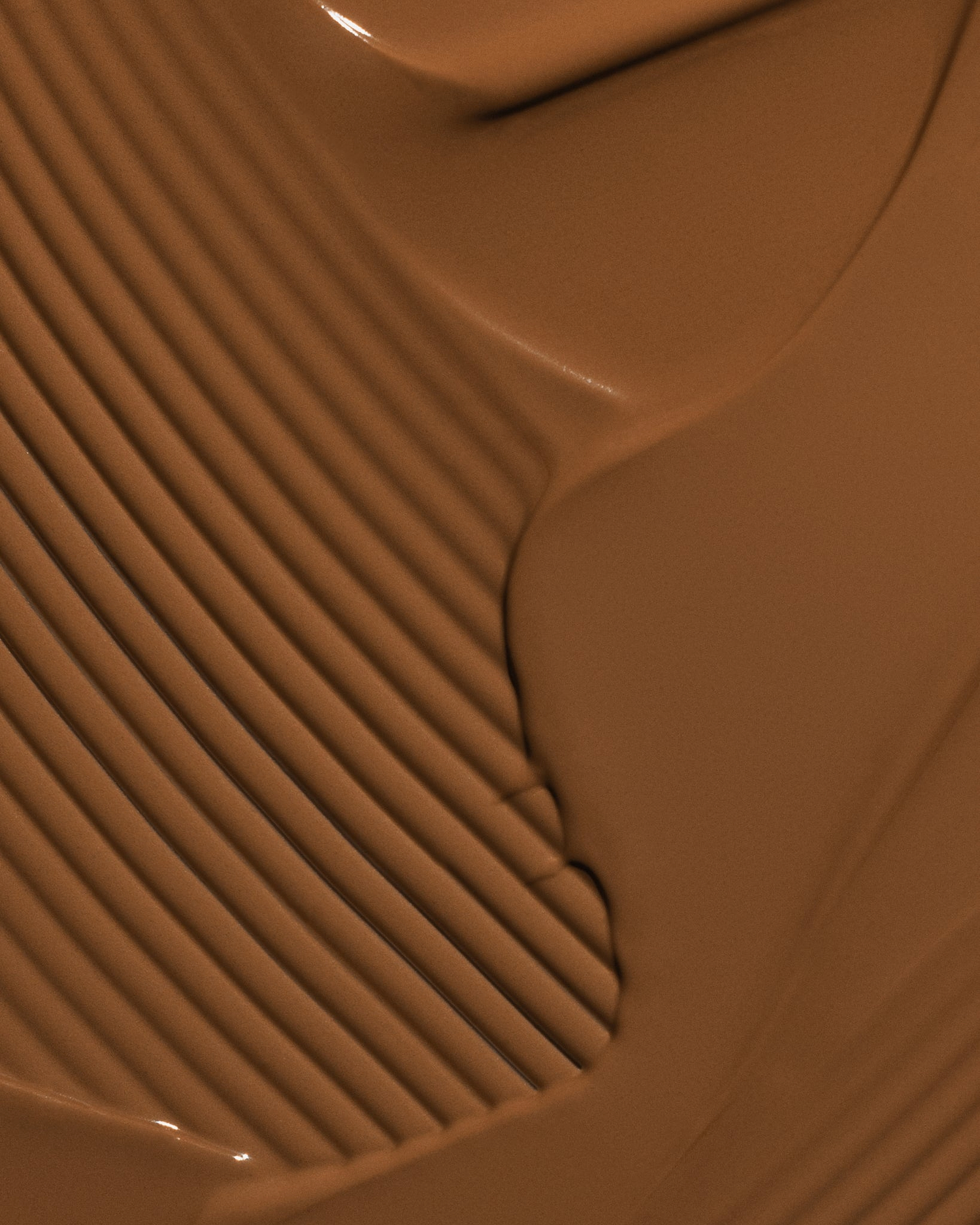 Texture close-up of MÁDARA Organic Skincare skinonym auburn A6094 �swatch demonstrates consistency and finish.