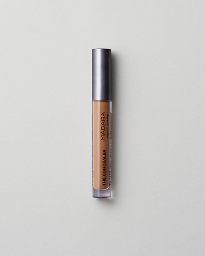 MÁDARA Organic Skincare amber concealer madara cosmetics A6115 concealer product photo on plain background.