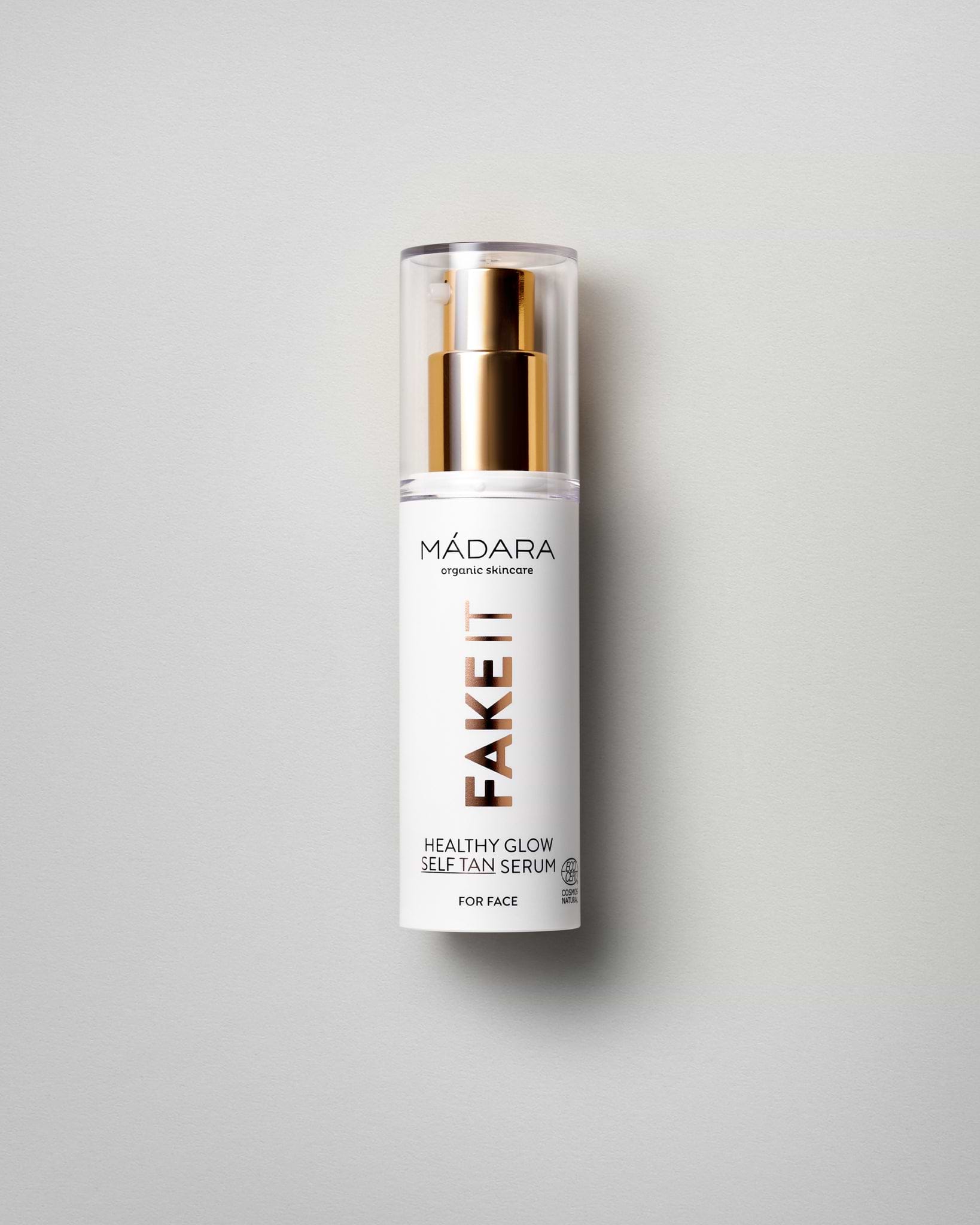 Model wearing MÁDARA Organic Skincare healthy glow self tan serum for face A3421 serum on skin; close-up portrait shows natural application results.