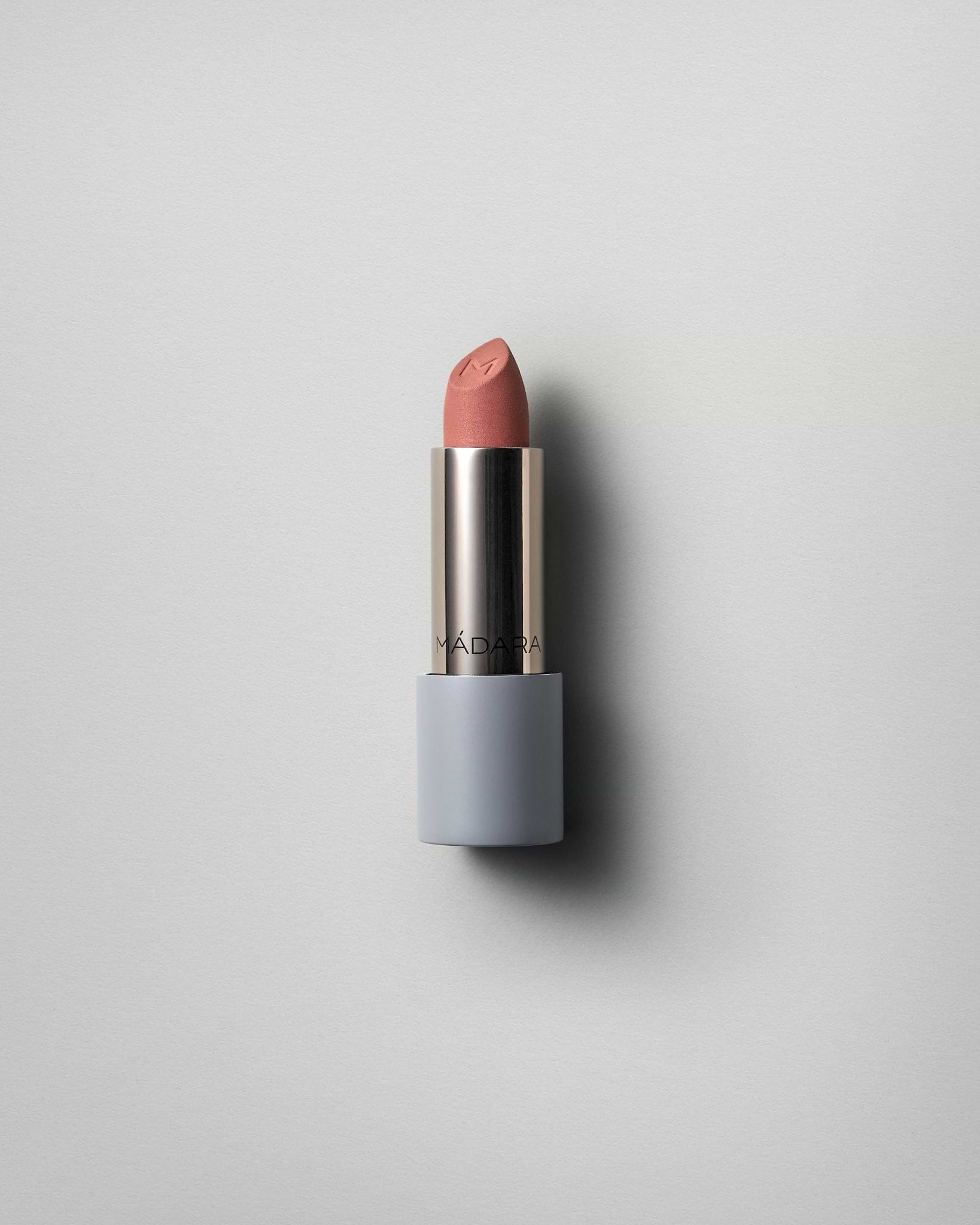 MÁDARA Organic Skincare matte cream lipstick dark nude A6305 face cream product photo on plain background.