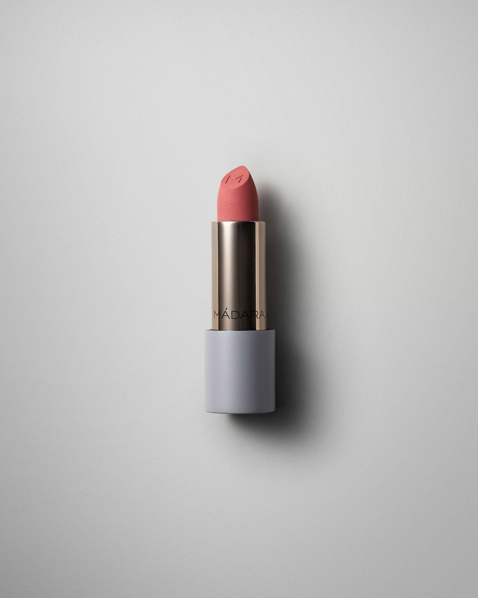 MÁDARA Organic Skincare matte cream lipstick warm nude A6302 face cream product photo on plain background.