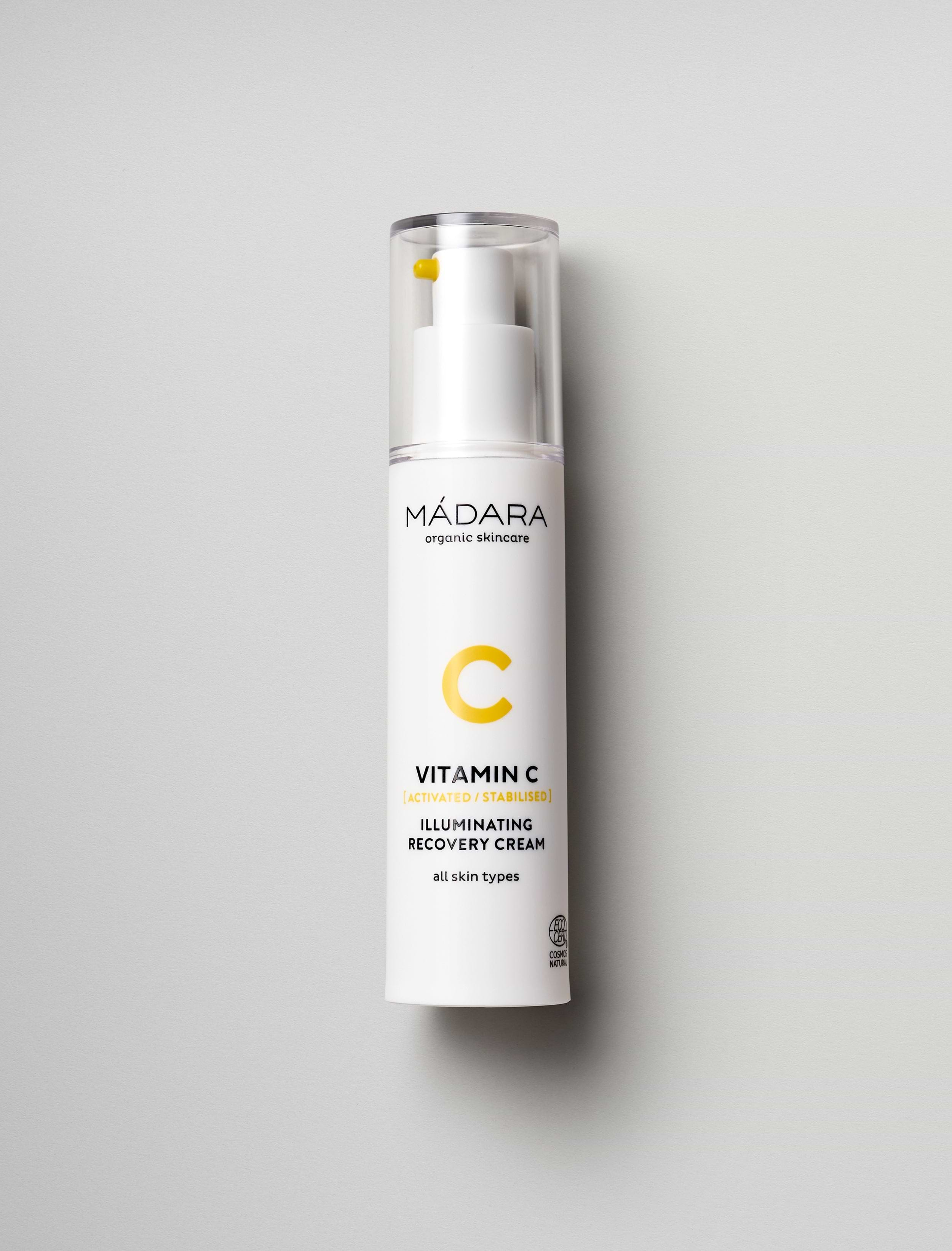 A 50 ml pump bottle of Madara Organic Skincare Vitamin C face cream for all skin types on a grey background