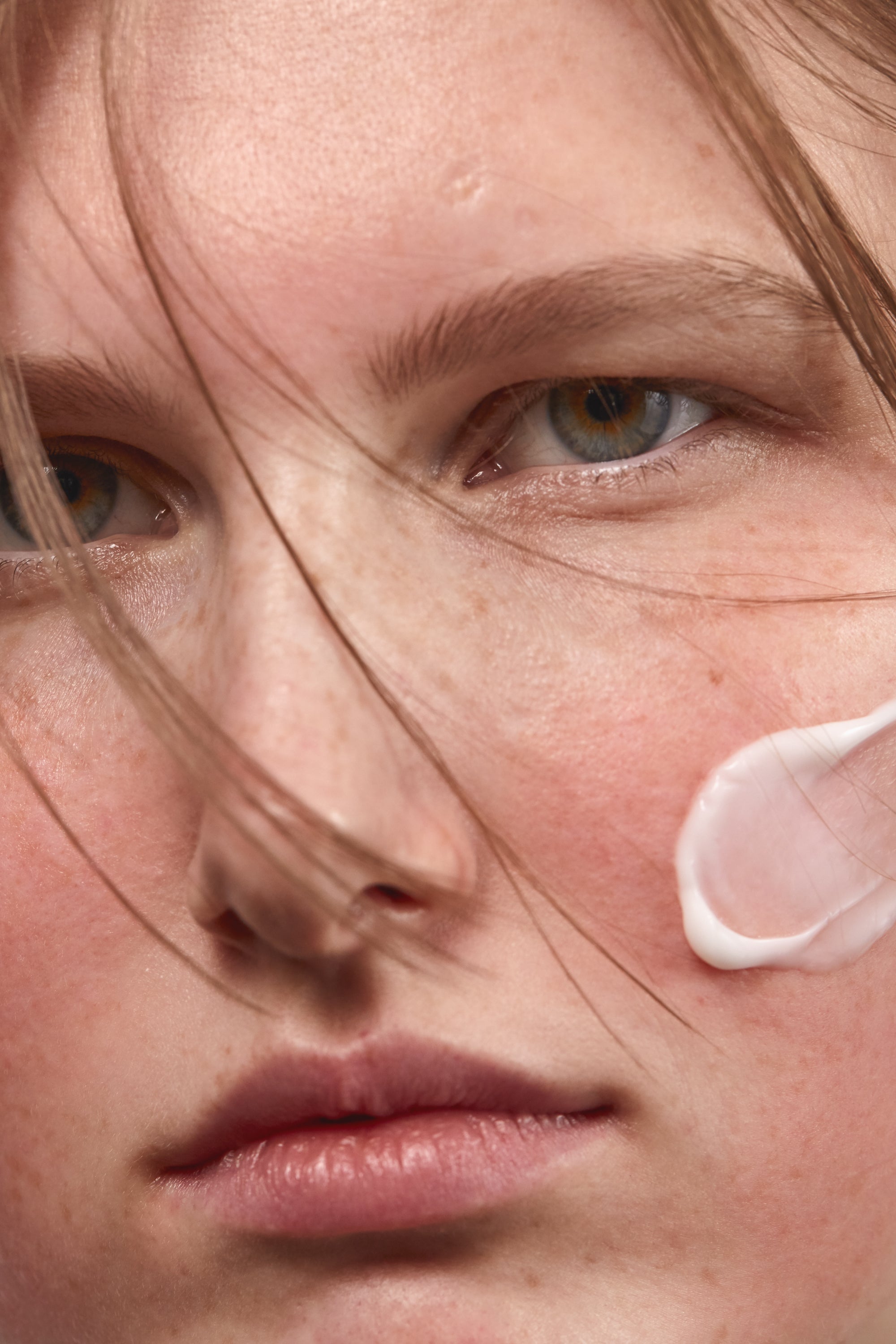 Texture of Madara SOS Moisturizing Face Cream on a Woman's Face