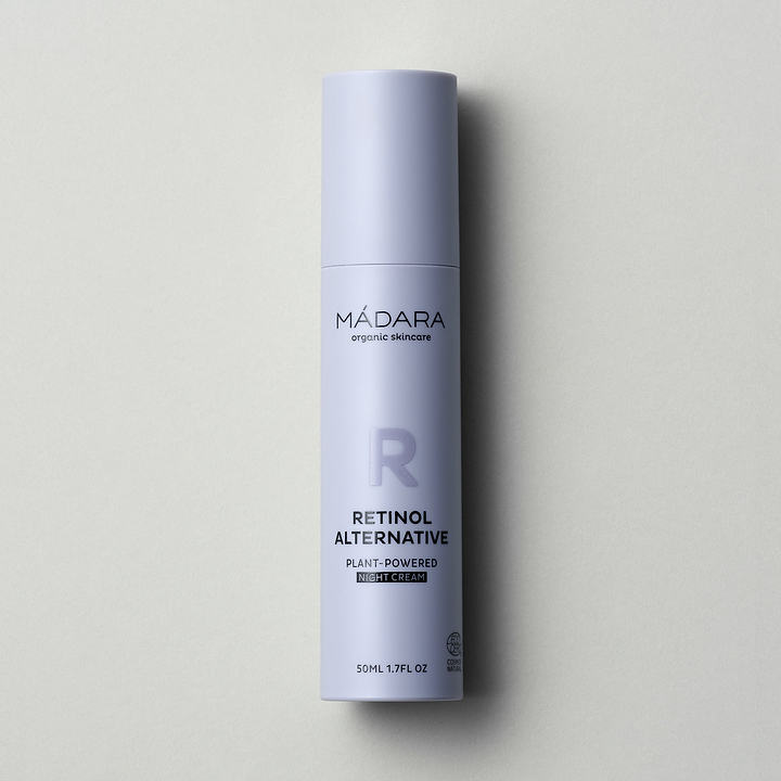 A 50 ml pump bottle of Madara Organic Skincare Retinol Alternative Plant-Powered Night Cream with cap on a grey background