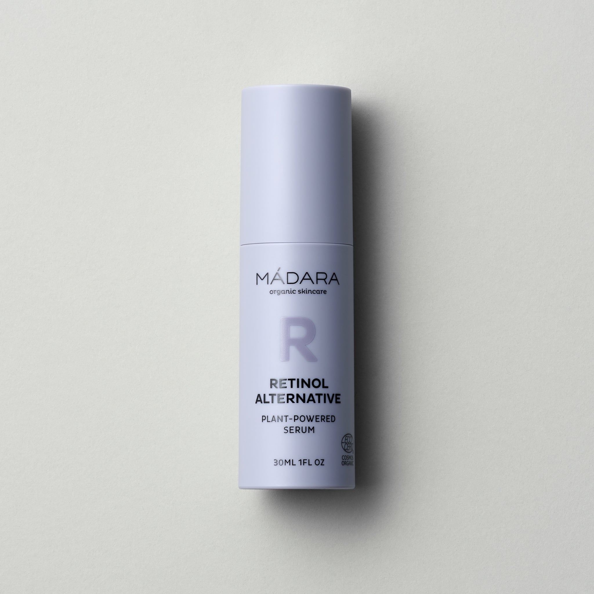 30ml pump bottle of Madara Cosmetics Retinol Alternative Plant-Powered Serum for face on a grey background