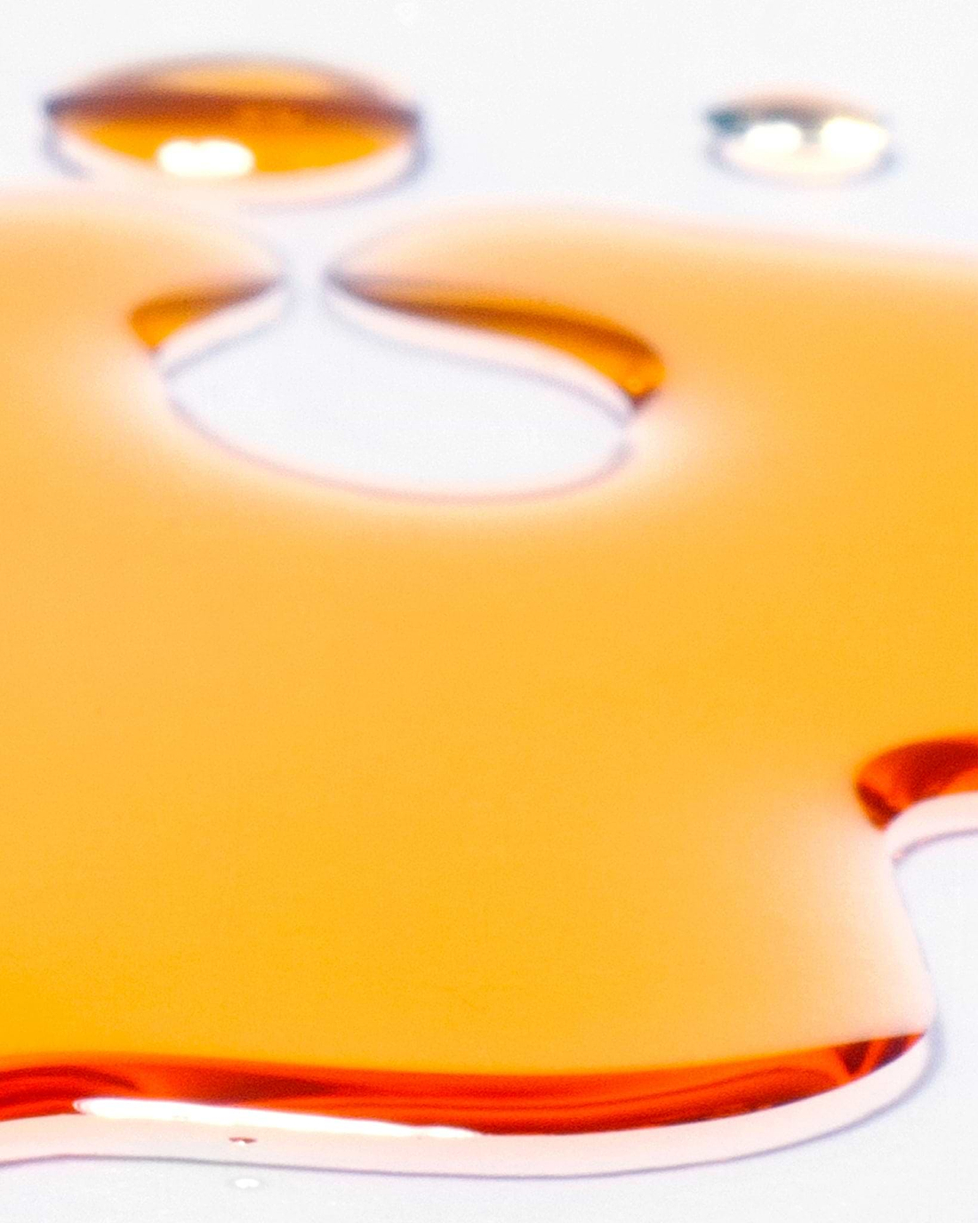 Madara SUPERSEED Age Recovery face oil spilled on a white surface.