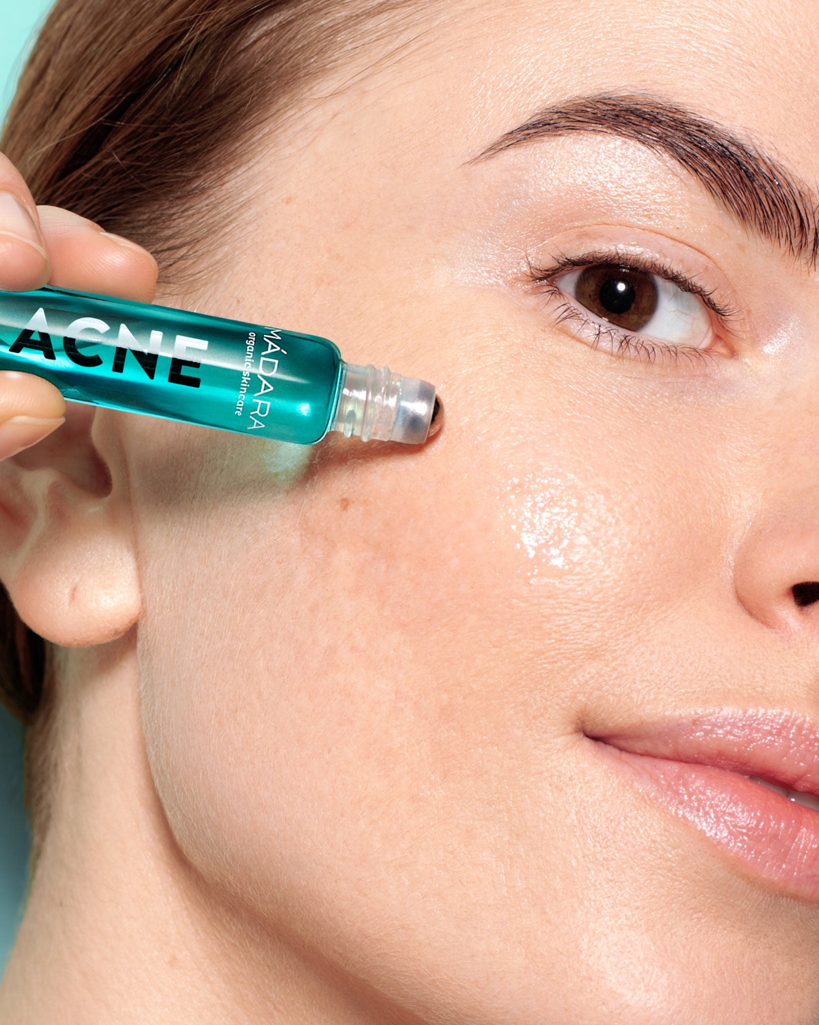 MÁDARA Organic Skincare acne spot roll on treatment product photo on plain background.