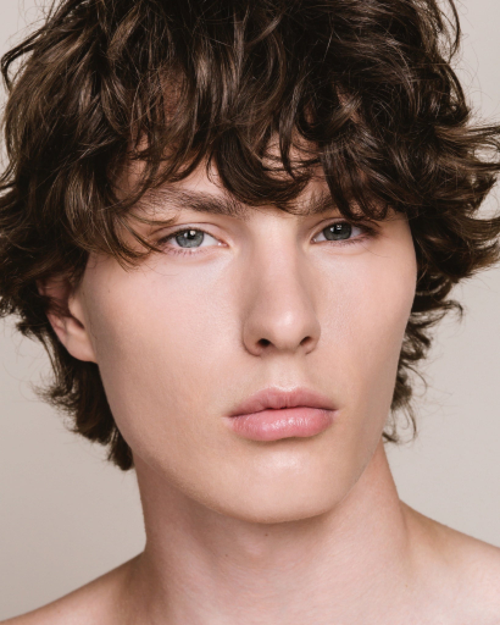 Model wearing MÁDARA Organic Skincare skin equal ivory on A6053 on skin; close-up portrait shows natural application results.