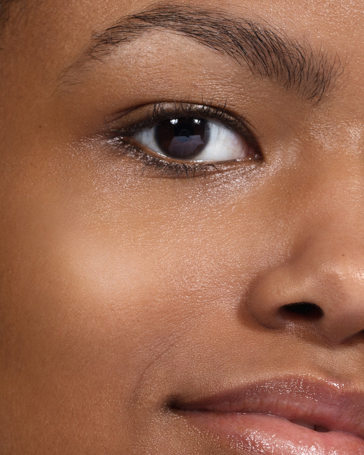 Model wearing MÁDARA Organic Skincare the concealer rich soil on A6116 concealer on skin; close-up portrait shows natural application results.