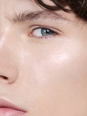 Close-up of Madara Luminous Perfecting Concealer model wearing shade latte