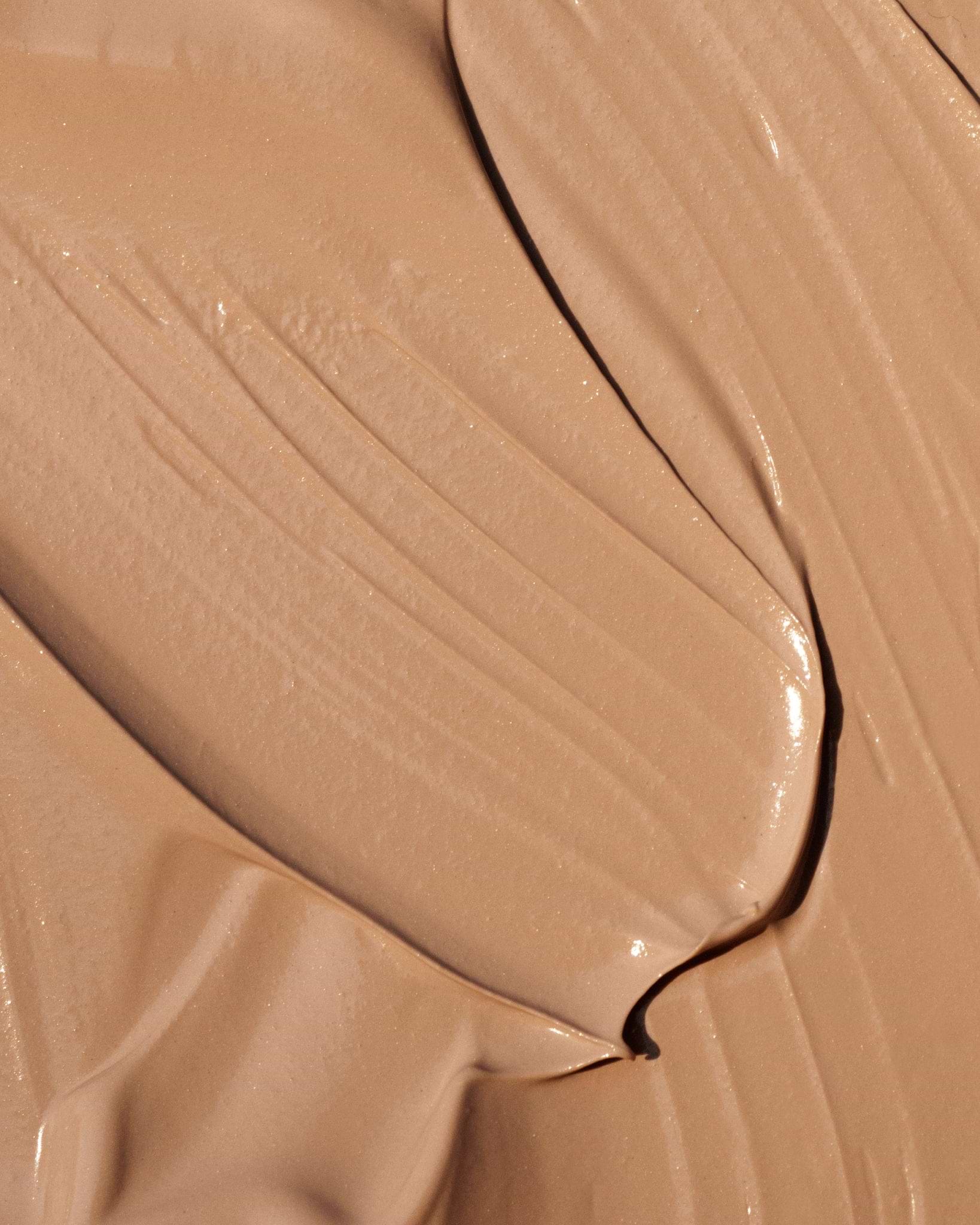 Texture close-up of MÁDARA Organic Skincare cc cream medium A3412 face cream �swatch demonstrates consistency and finish.