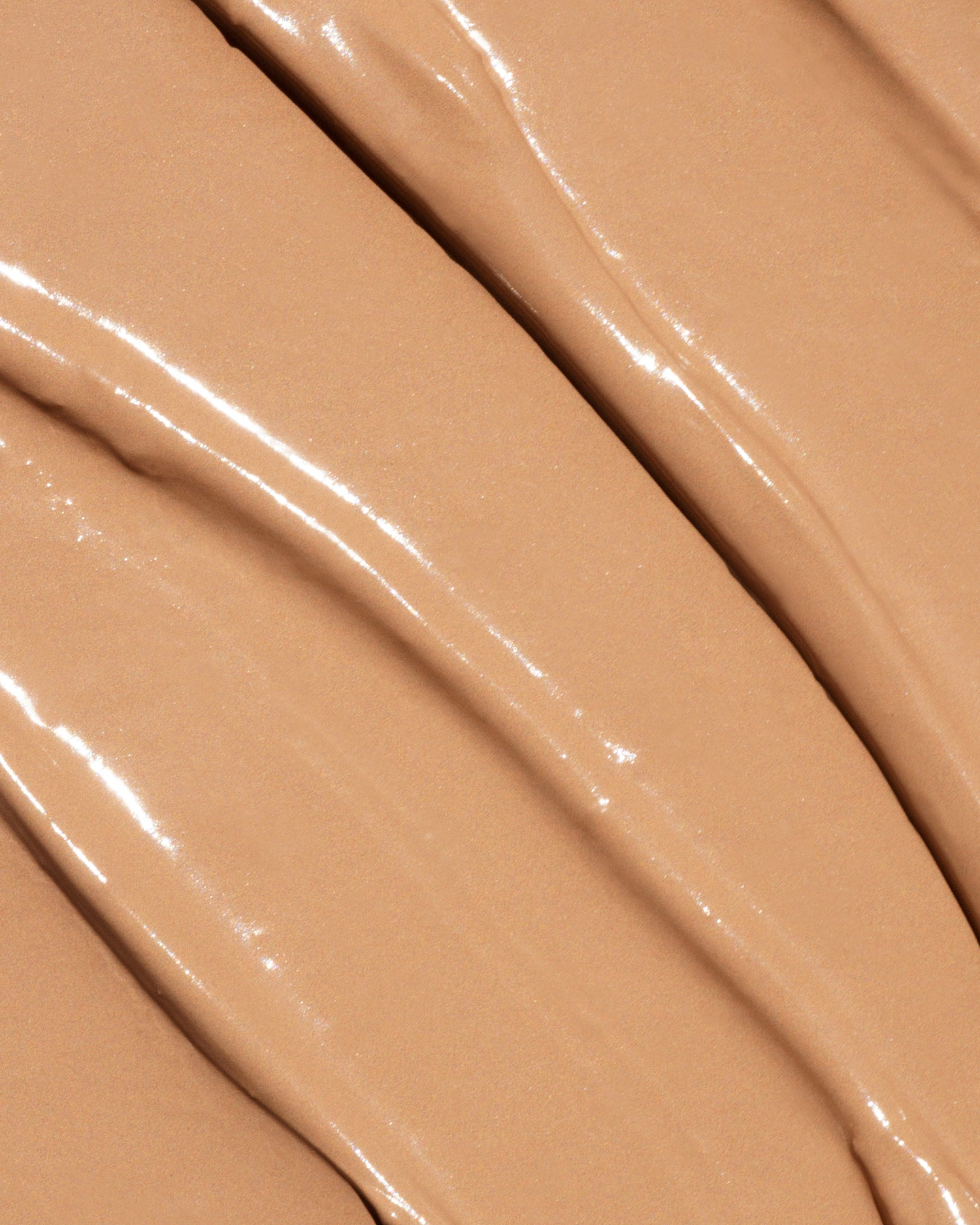Texture close-up of MÁDARA Organic Skincare the concealer golden hour A6110 concealer �swatch demonstrates consistency and finish.