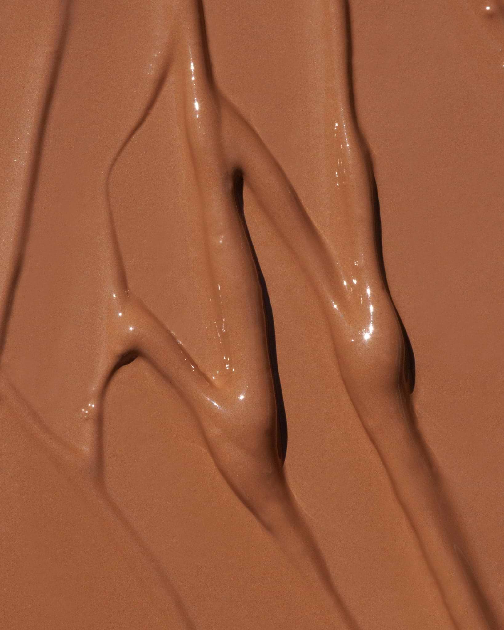 Texture close-up of MÁDARA Organic Skincare the concealer hazelnut A6104 concealer �swatch demonstrates consistency and finish.