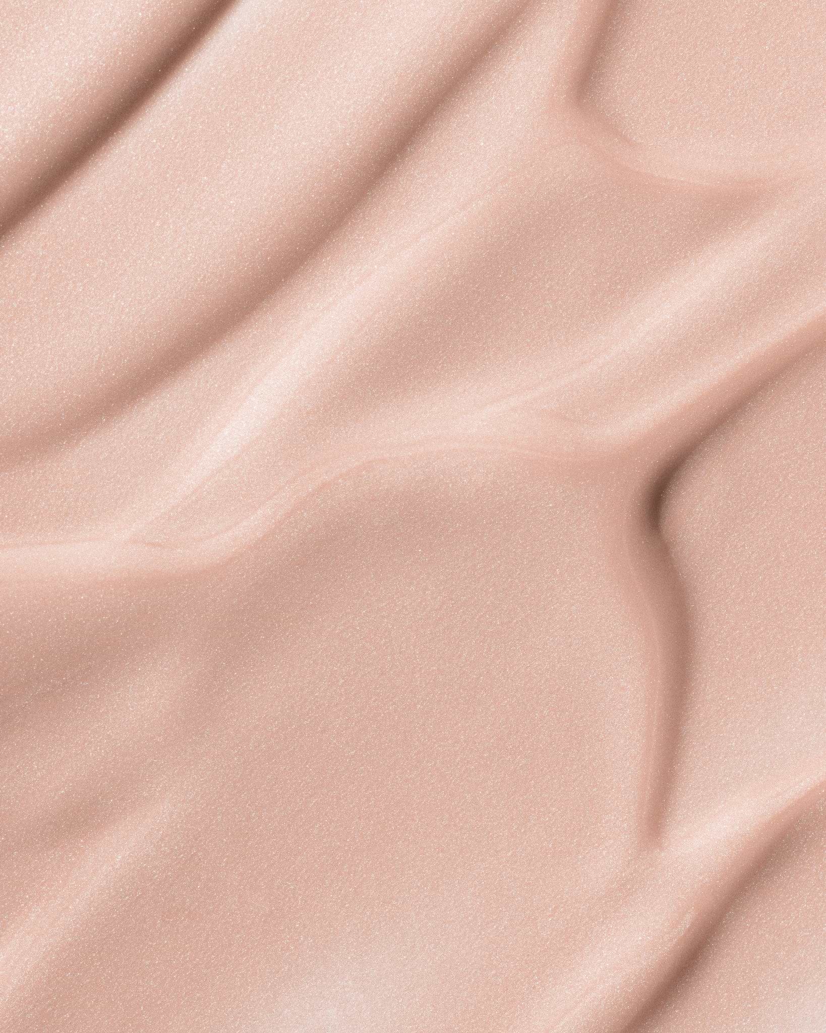 Texture close-up of MÁDARA Organic Skincare may flower A3511 �swatch demonstrates consistency and finish.