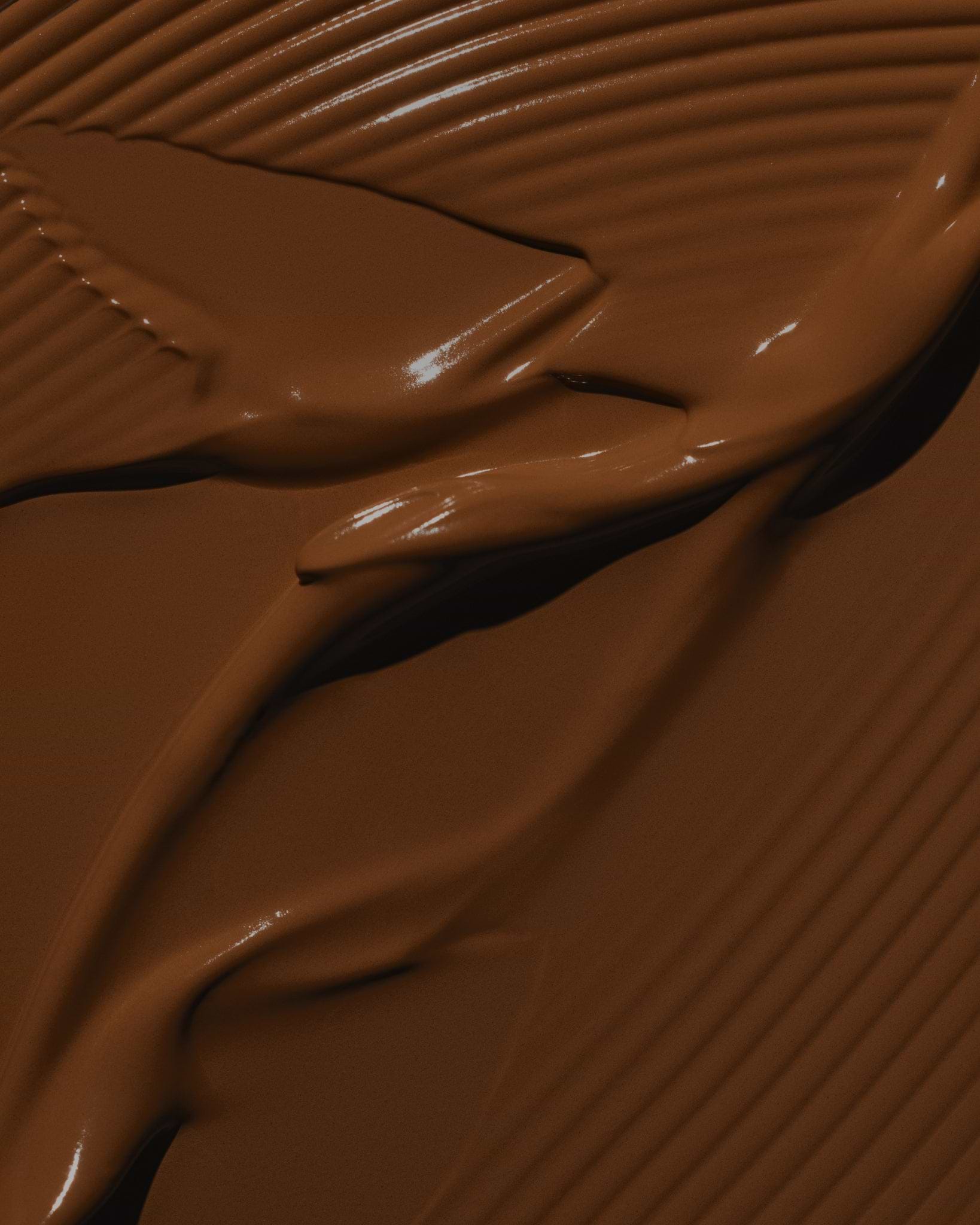 Texture close-up of MÁDARA Organic Skincare skinonym chestnut A6097 �swatch demonstrates consistency and finish.