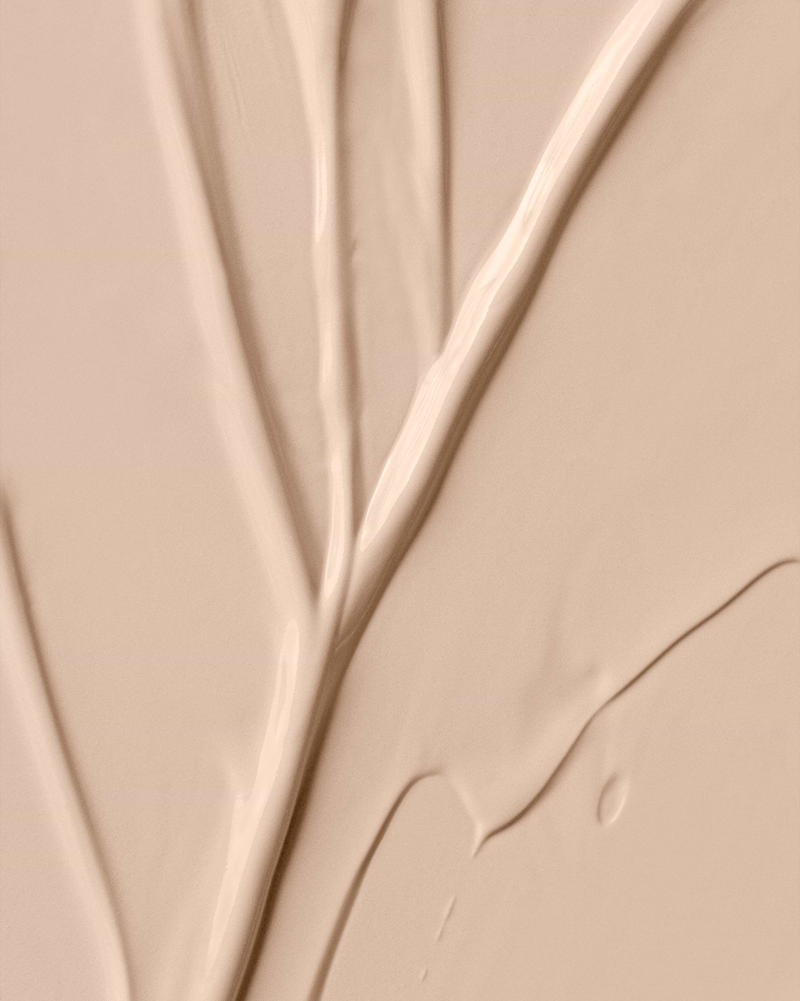 Texture close-up of MÁDARA Organic Skincare skinonym ivory A6082 �swatch demonstrates consistency and finish.