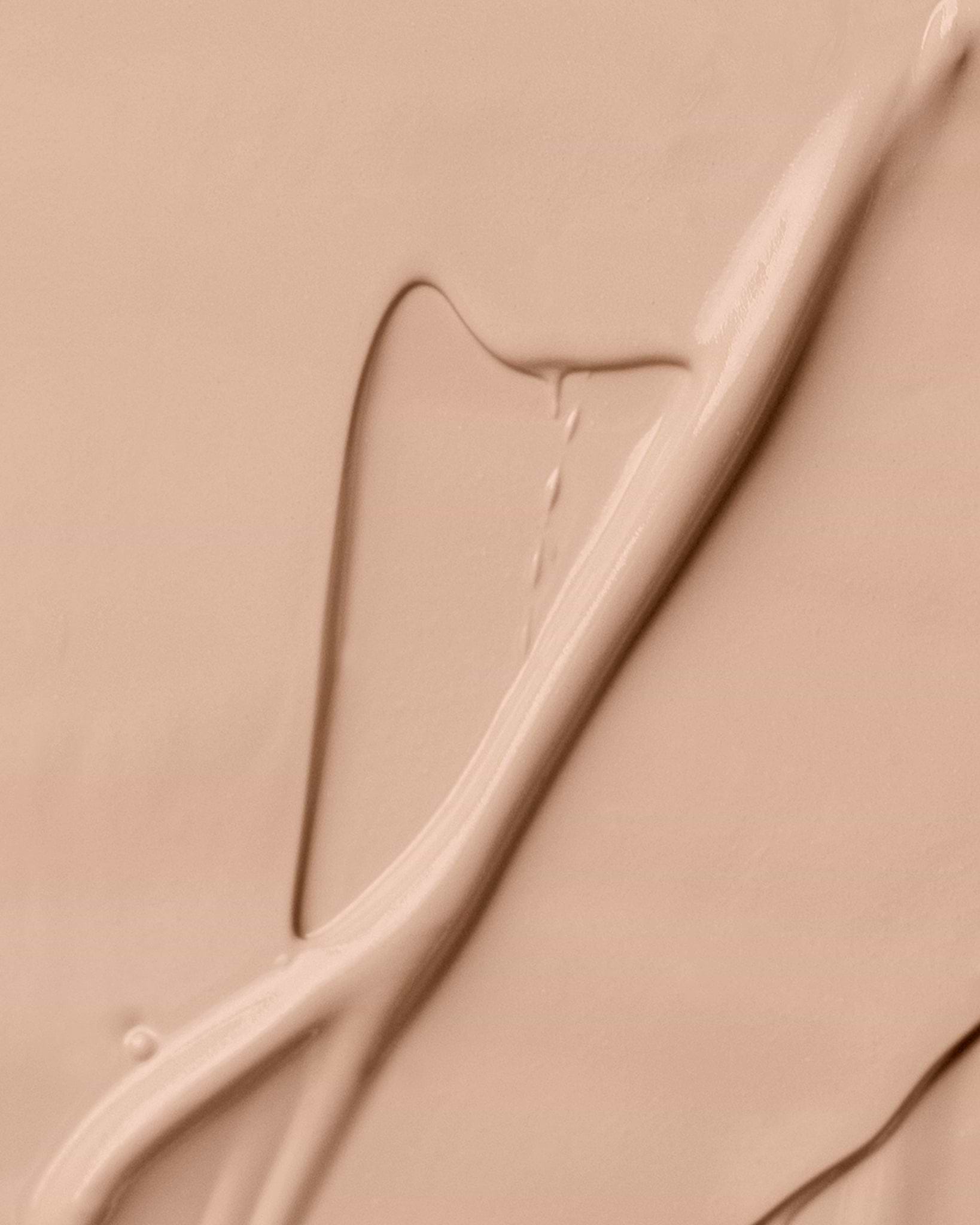 Texture close-up of MÁDARA Organic Skincare skinonym rose ivory A6083 �swatch demonstrates consistency and finish.