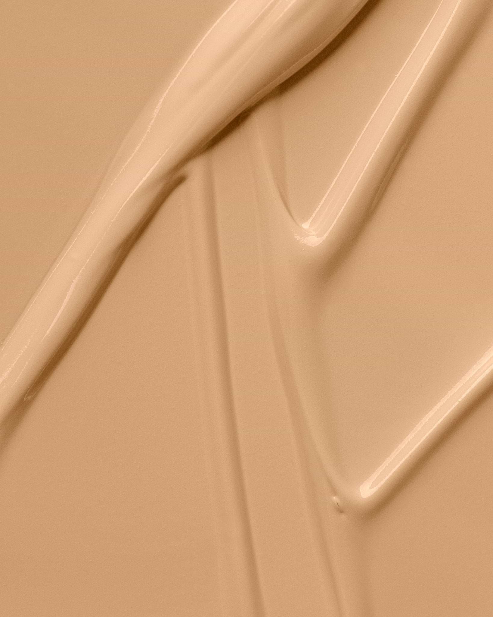 Texture close-up of MÁDARA Organic Skincare skinonym sand A6085 �swatch demonstrates consistency and finish.