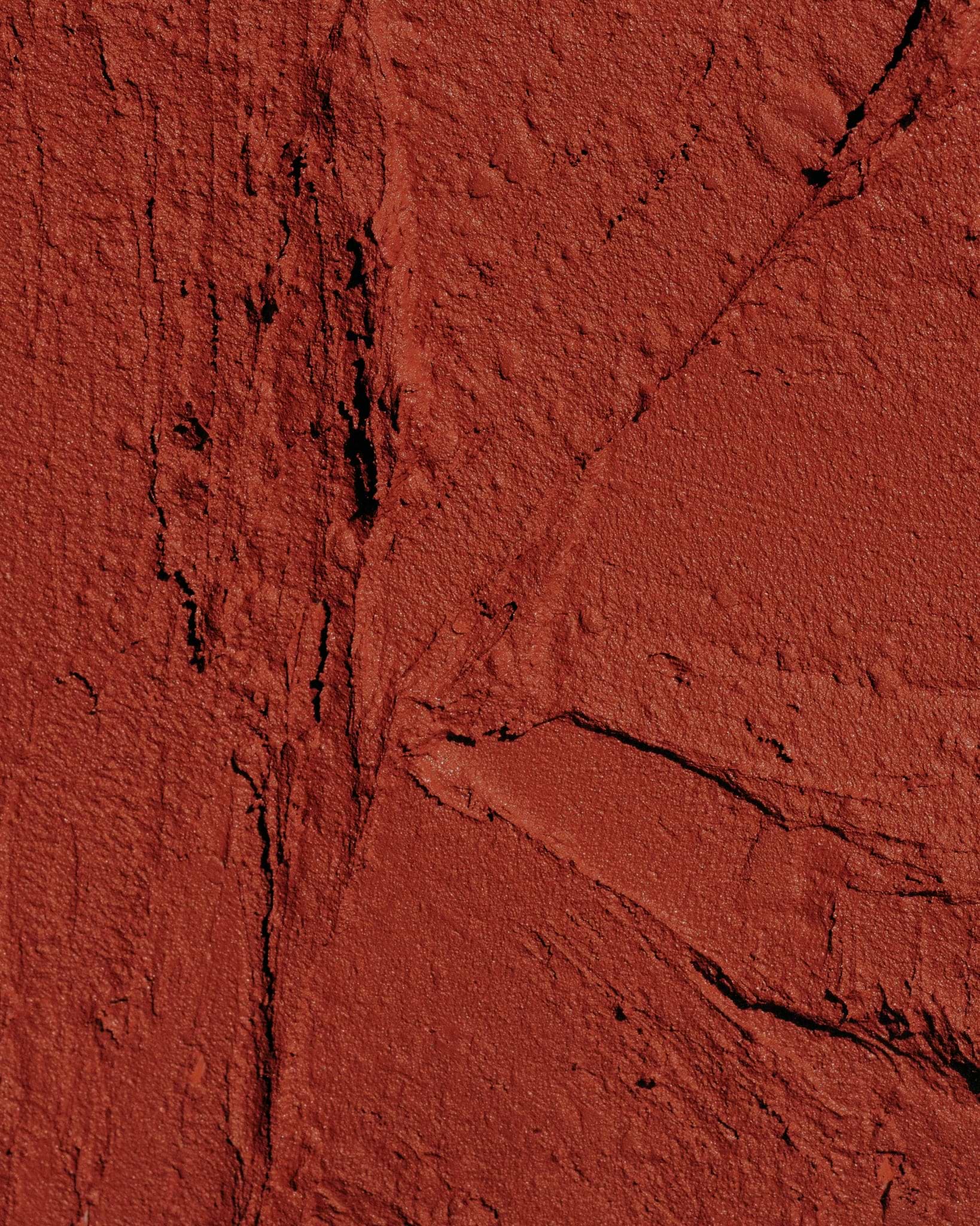 Texture close-up of MÁDARA Organic Skincare velvet wear magma A6303 �swatch demonstrates consistency and finish.