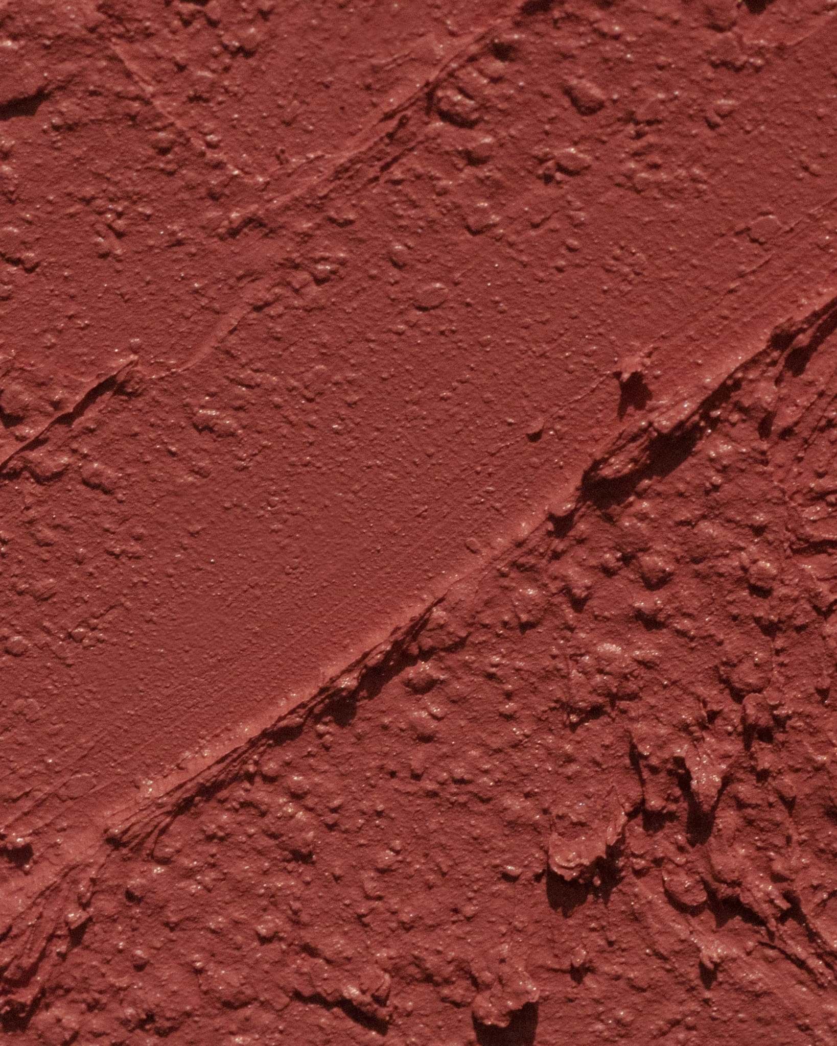 Texture close-up of MÁDARA Organic Skincare velvet wear warm nude A6302 �swatch demonstrates consistency and finish.