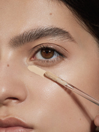 Close-up of Madara Luminous Perfecting Concealer model wearing shade warm latte