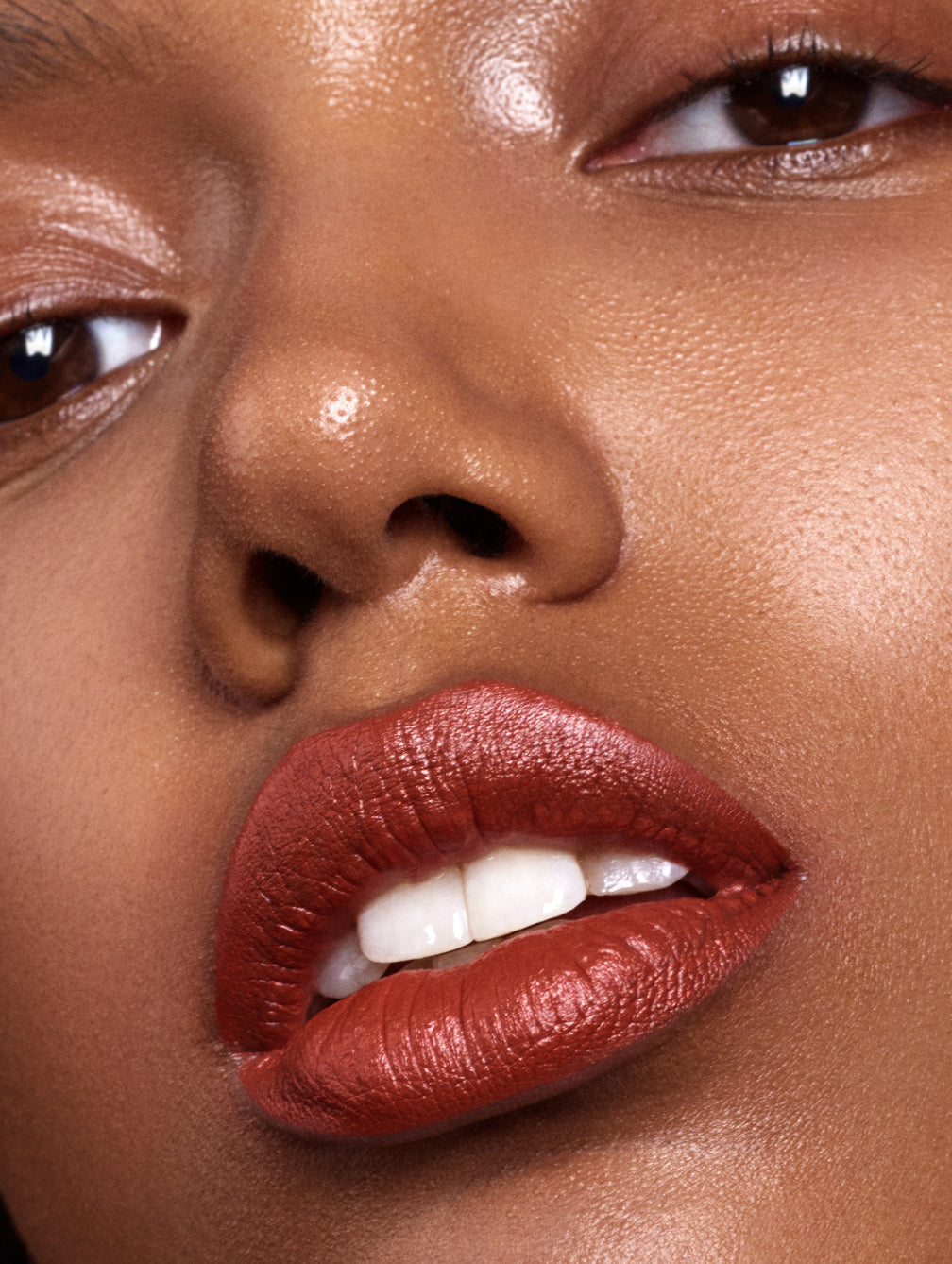 Close-up of model wearing madara velvet wear matte cream lipstick shade magma
