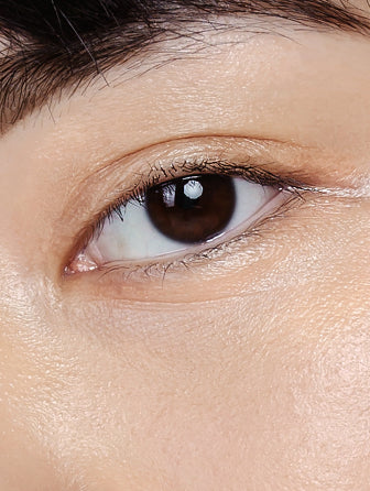 Close-up of Madara Luminous Perfecting Concealer model wearing shade honey
