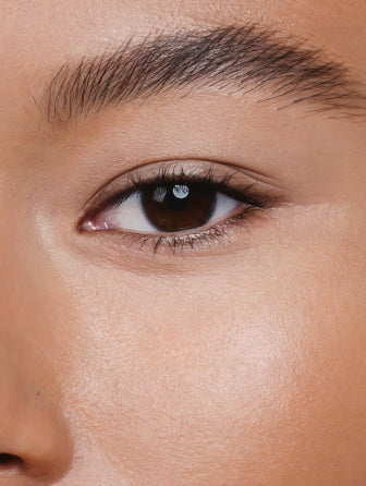 Close-up of Madara Luminous Perfecting Concealer model wearing shade almond