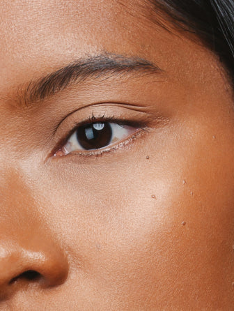 Close-up of Madara Luminous Perfecting Concealer model wearing shade hazelnut