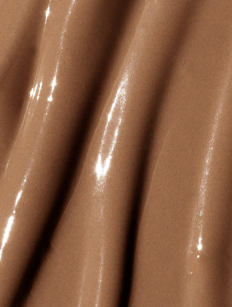 Close-up of Madara Luminous Perfecting Concealer texture in shade amber