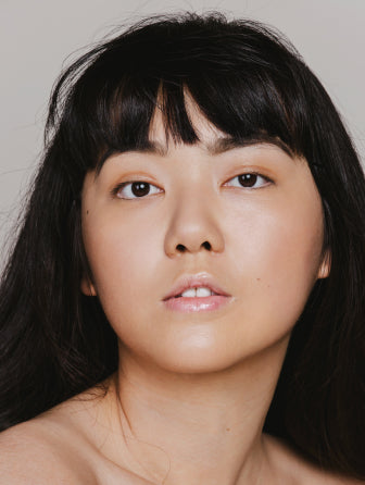 Madara Skin Equal Soft Glow foundation model wearing shade sand