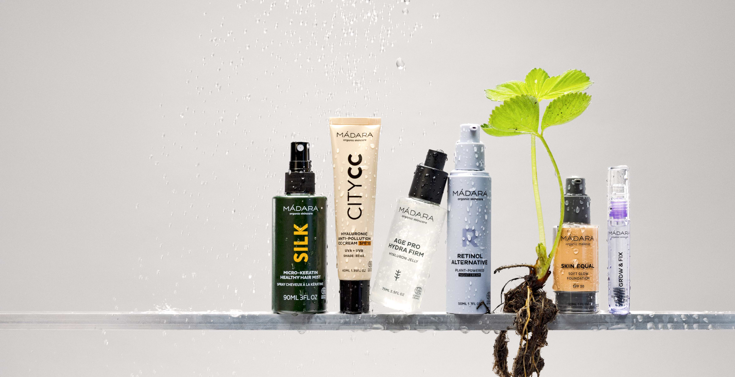 MÁDARA Skinonym foundation and Silk hair mist with fresh plant roots and water droplets highlighting natural beauty sale