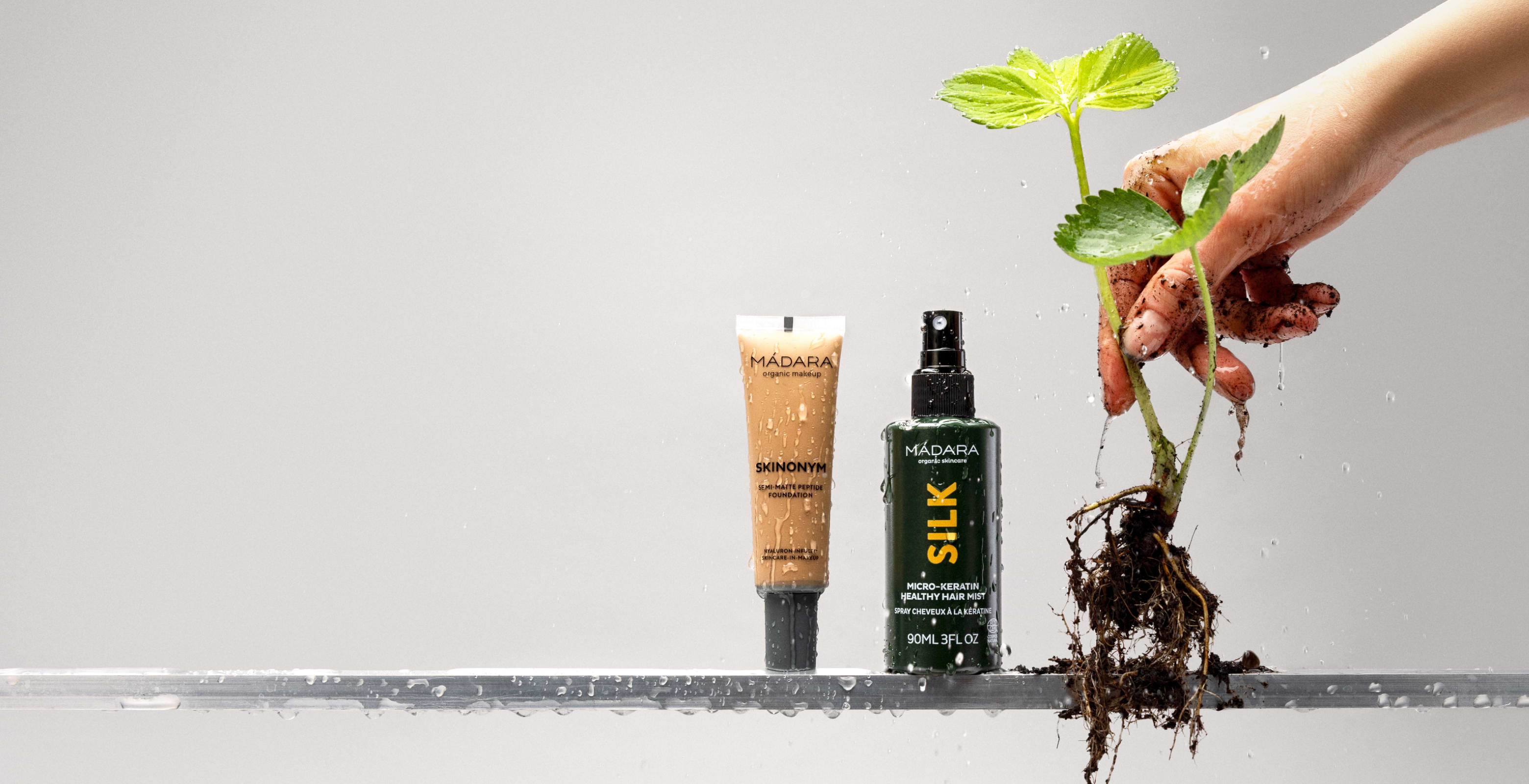 MÁDARA Skinonym foundation and Silk hair mist with fresh plant roots and water droplets highlighting natural beauty sale