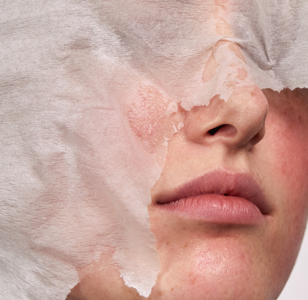 Close-up of a face with a peeling mask texture revealing slightly flushed, sensitive-looking skin, illustrating the concept of soothing and restoring sensitive skin