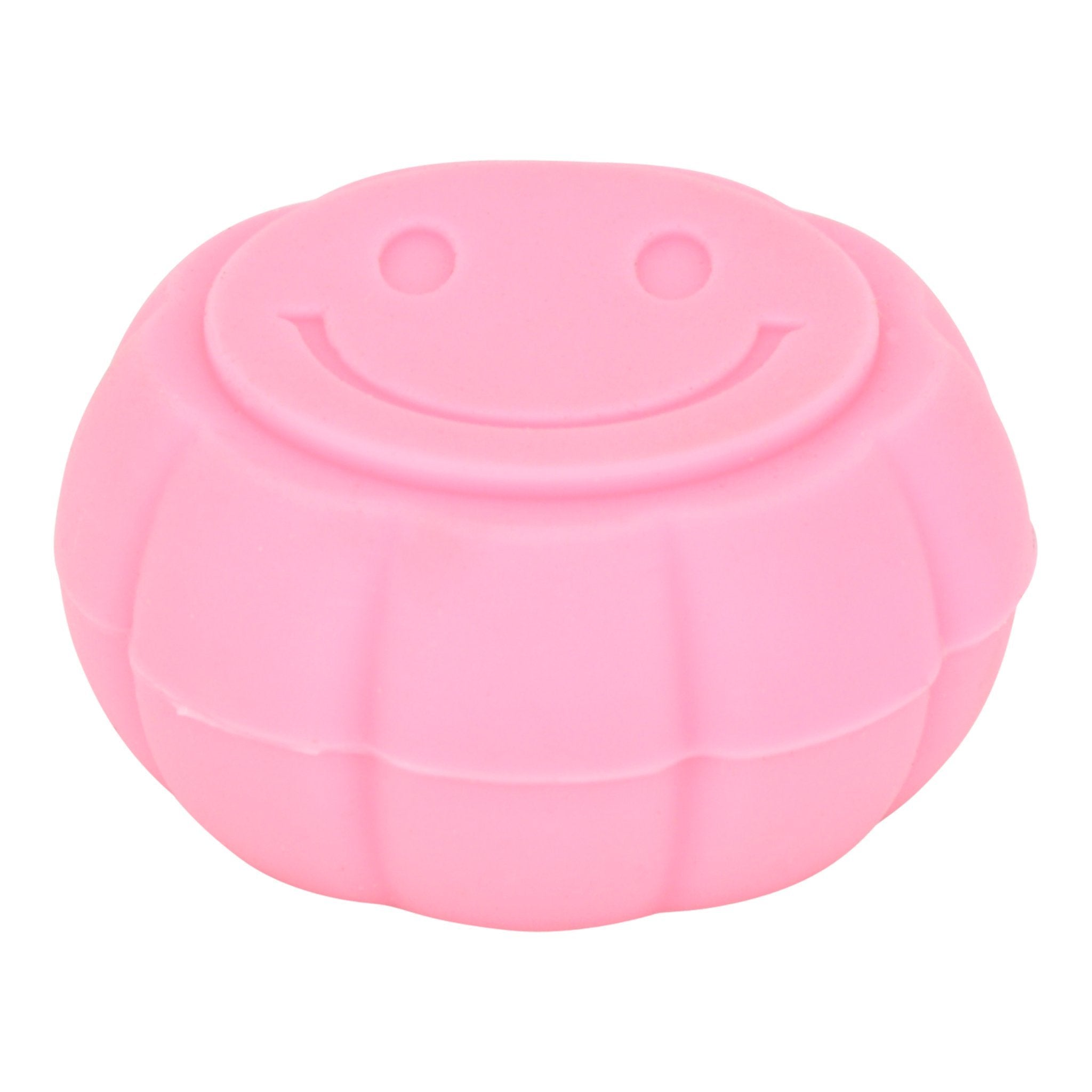 High angle and front shot of pink round silicone container smoking accessory with smiley design on lid

