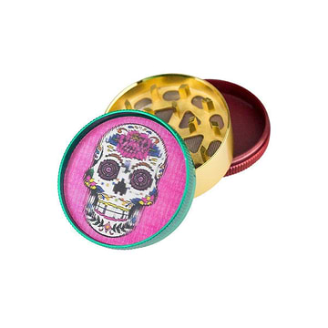 50-mm diameter metal herb grinder with 3 parts with two chambers colorful floral skull design embossed on pink lid