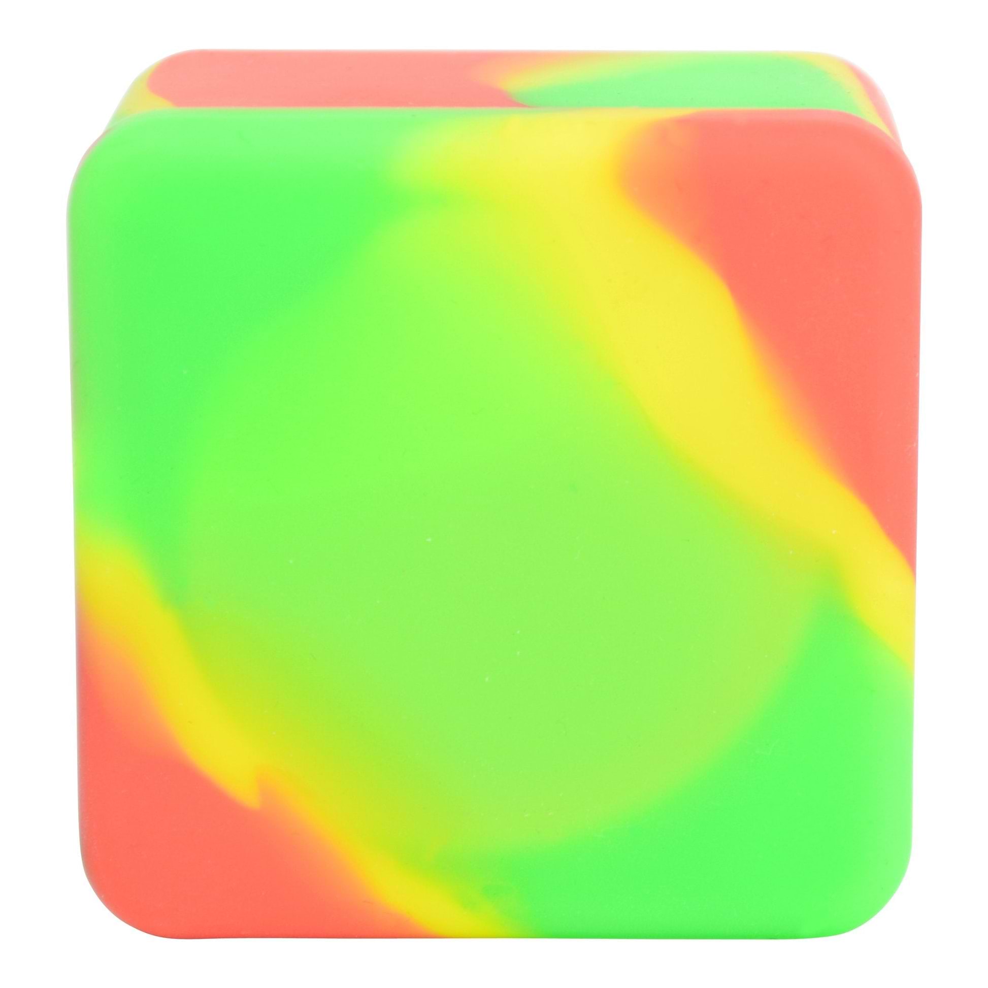 Full close up shot of closed square rasta-themed wax container in red, yellow and green color swirls