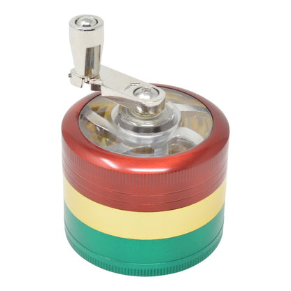 High angle shot of closed rasta dub grinder in red, yellow, green colors with hand crank on left slightly back