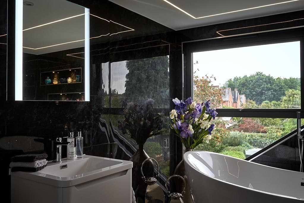 bathroom design showing mirror and wall tiles