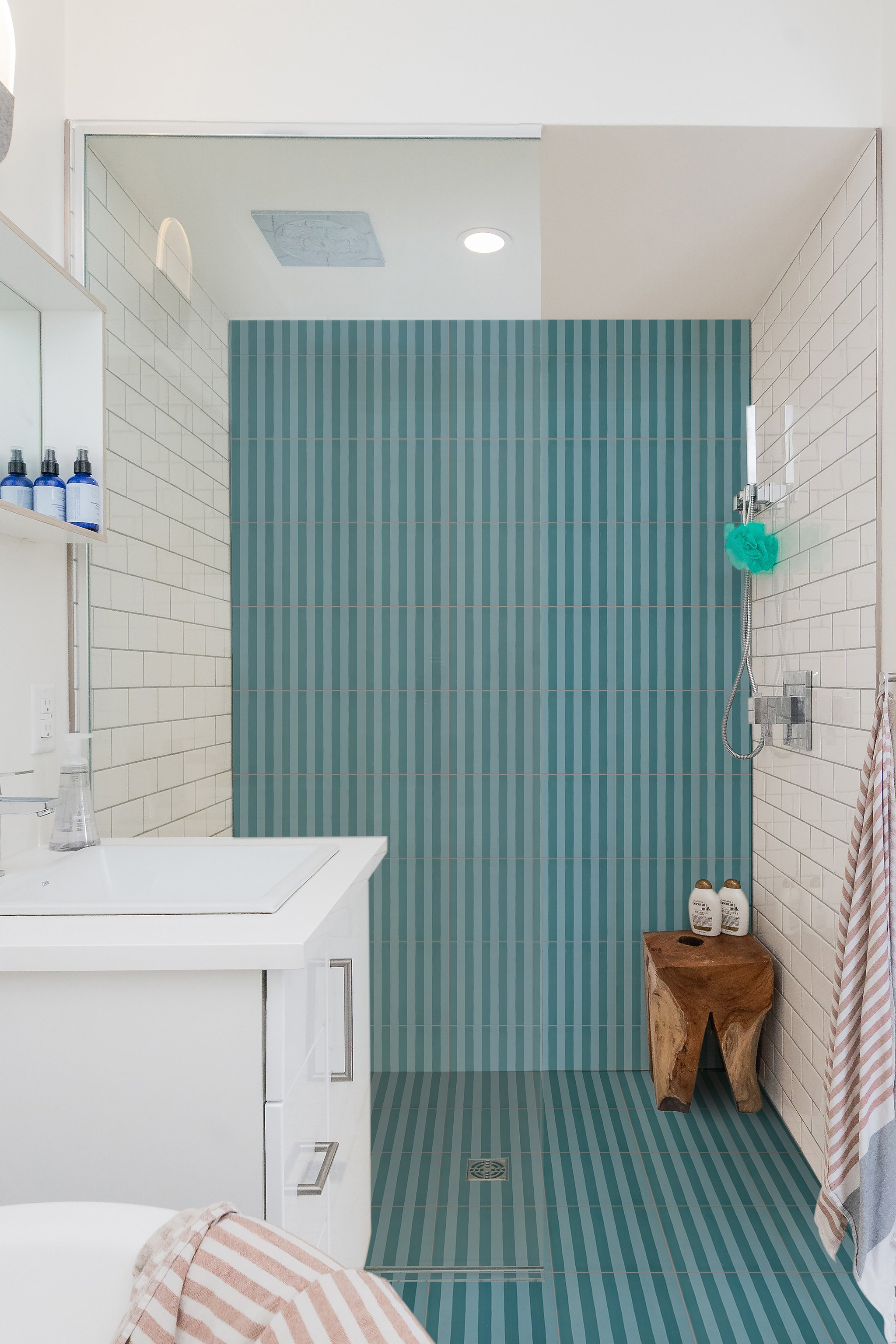 A spacious wetroom featuring Deck Chair Porcelain Verdant tiles stocked by Hyperion Tiles