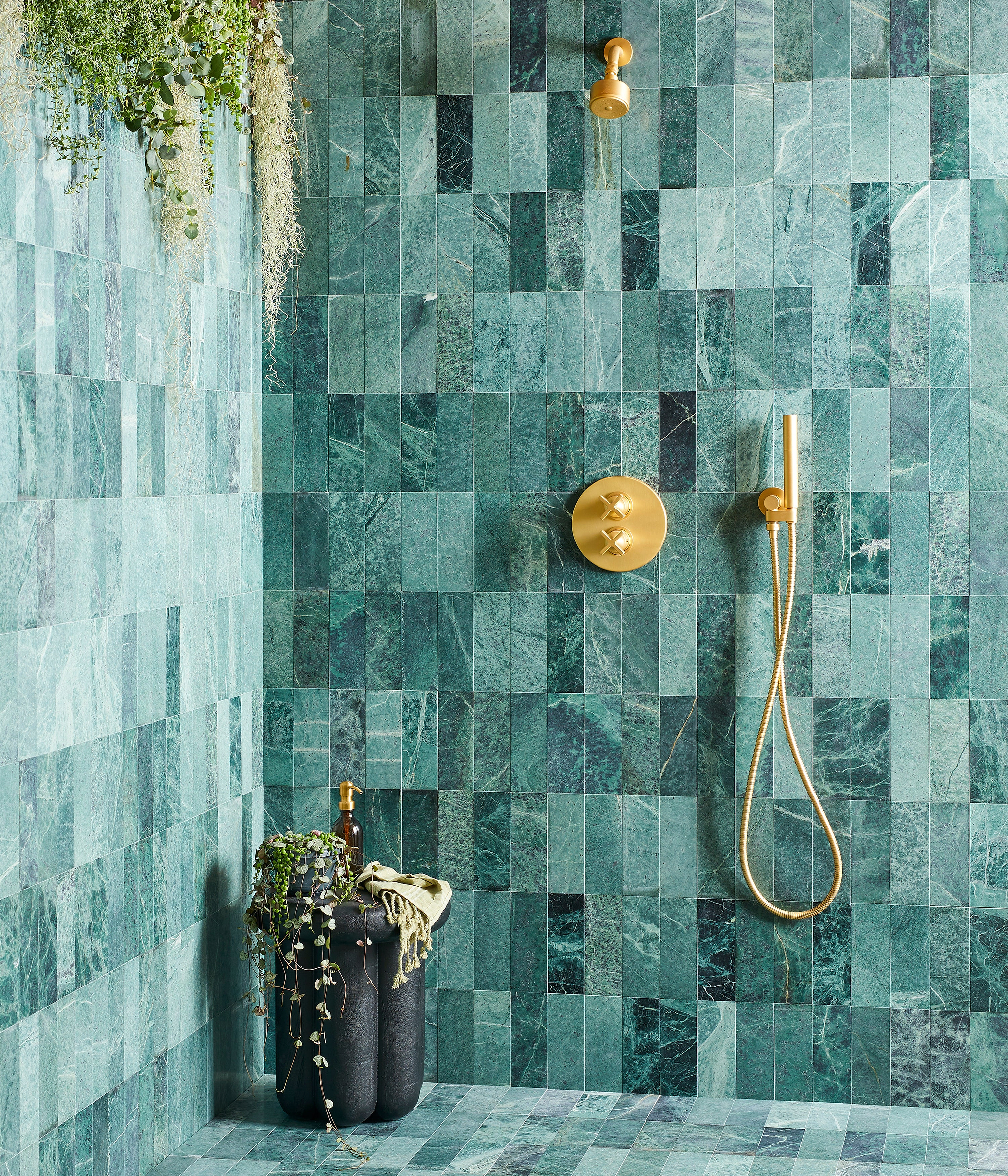 Wetroom with Green Herringbone Honed marble Tiles stocked by Hyperion Tiles