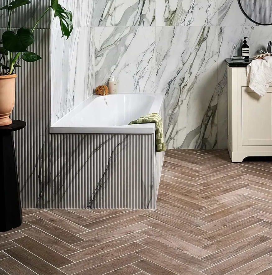 Bathroom space with Chatham Porcelain Walnut herringbone pattern tiles stocked by Hyperion Tiles